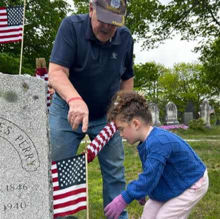 student placing a flag